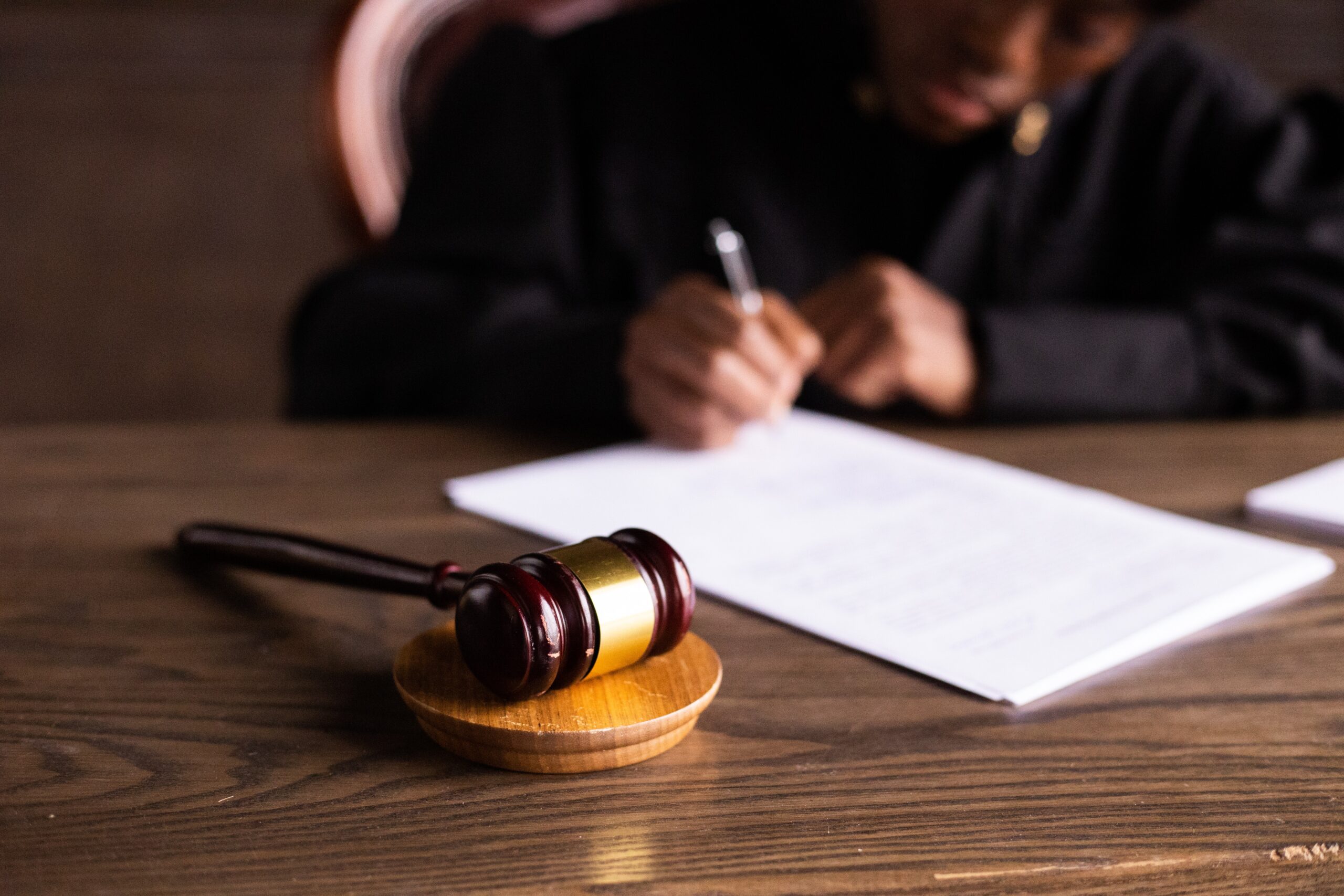 Why Victims Are Filing Paraquat Claims - Judge signing final claims papers - Carey Danis & Lowe